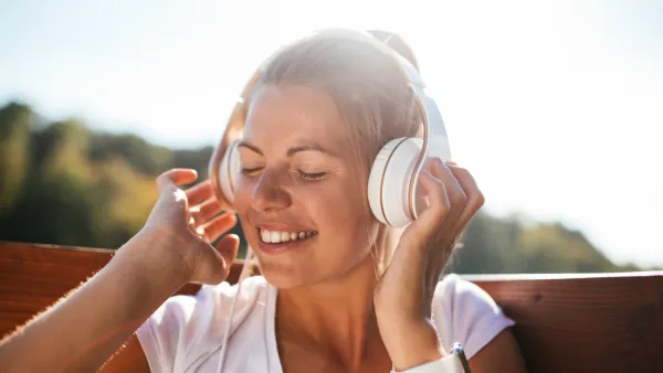 Woman wearing wireless headphones while relaxing — Amazon Prime Day headphone deals 2025