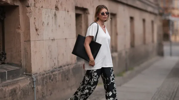 BERLIN, GERMANY - JUNE 06: Aline Kaplan wearing Zara black and white wide leg pattern pants, white Zara shirt, Marc Jacobs round silver shades and Agneel black leather bag on June 06, 2023 in Berlin, Germany. (Photo by Jeremy Moeller/Getty Images)