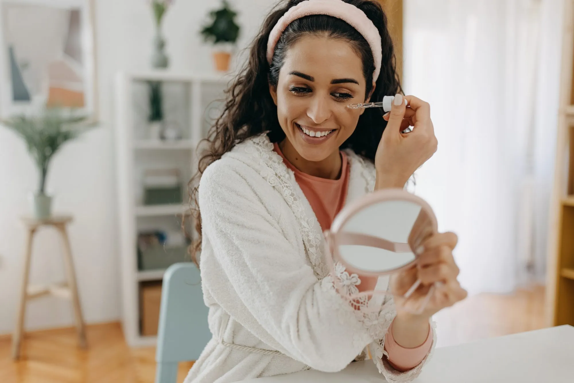 One brunette applying face serum to make her face beautiful