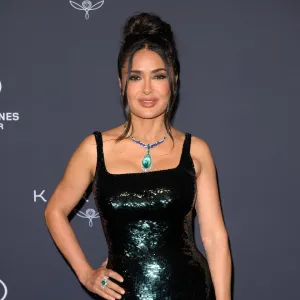 Salma Hayek Playfully Unties Her Bikini Bottoms While Dancing on a Balcony