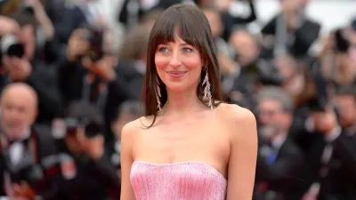 Dakota Johnson attends the "Highest 2 Lowest" red carpet at the 78th annual Cannes Film Festival at Palais des Festivals on May 19, 2025 in Cannes, France.