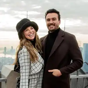 Hannah Brown Lets Fiance Adam Carry Her Wedding Dress Into Airport Ahead of Nuptials GettyImages 1358317798