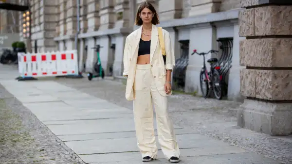 BERLIN, GERMANY - AUGUST 02: Jacqueline Zelwis is seen wearing H&M pants in beige, H&M Blazer, Understatement Bustier HVISK bag, Vans Sneakers on August 02, 2021 in Berlin, Germany. (Photo by Christian Vierig/Getty Images)