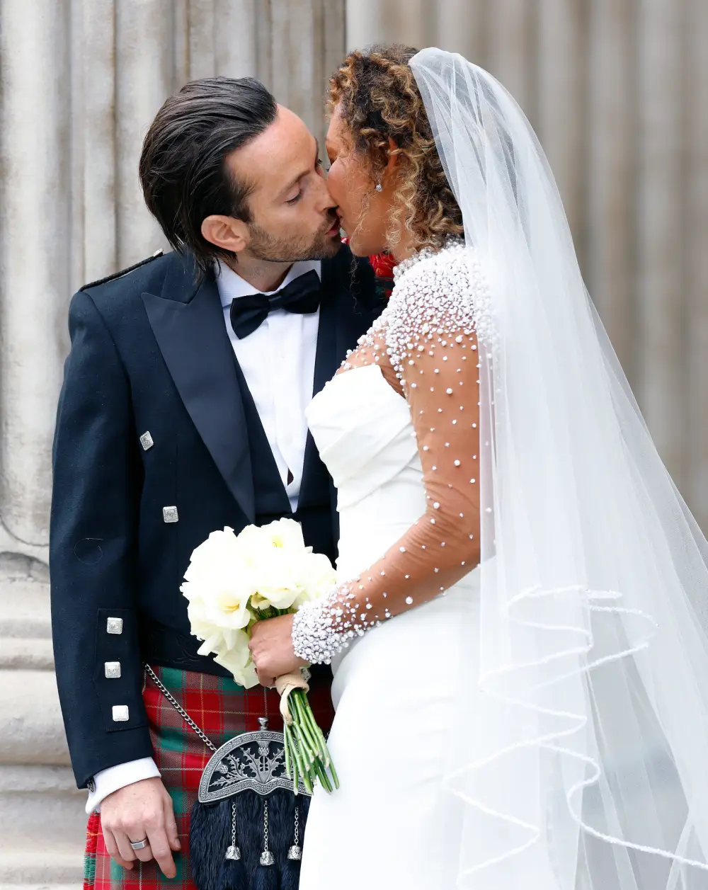 Mel-and-Rory-wedding-kiss-GettyImages-2223784577.