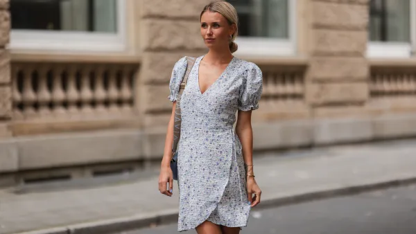 DUSSELDORF, GERMANY - AUGUST 07: Scarlett Gartmann wearing Neo Noir flower mini dress and Majavia blue bag on August 07, 2021 in Dusseldorf, Germany. (Photo by Jeremy Moeller/Getty Images)