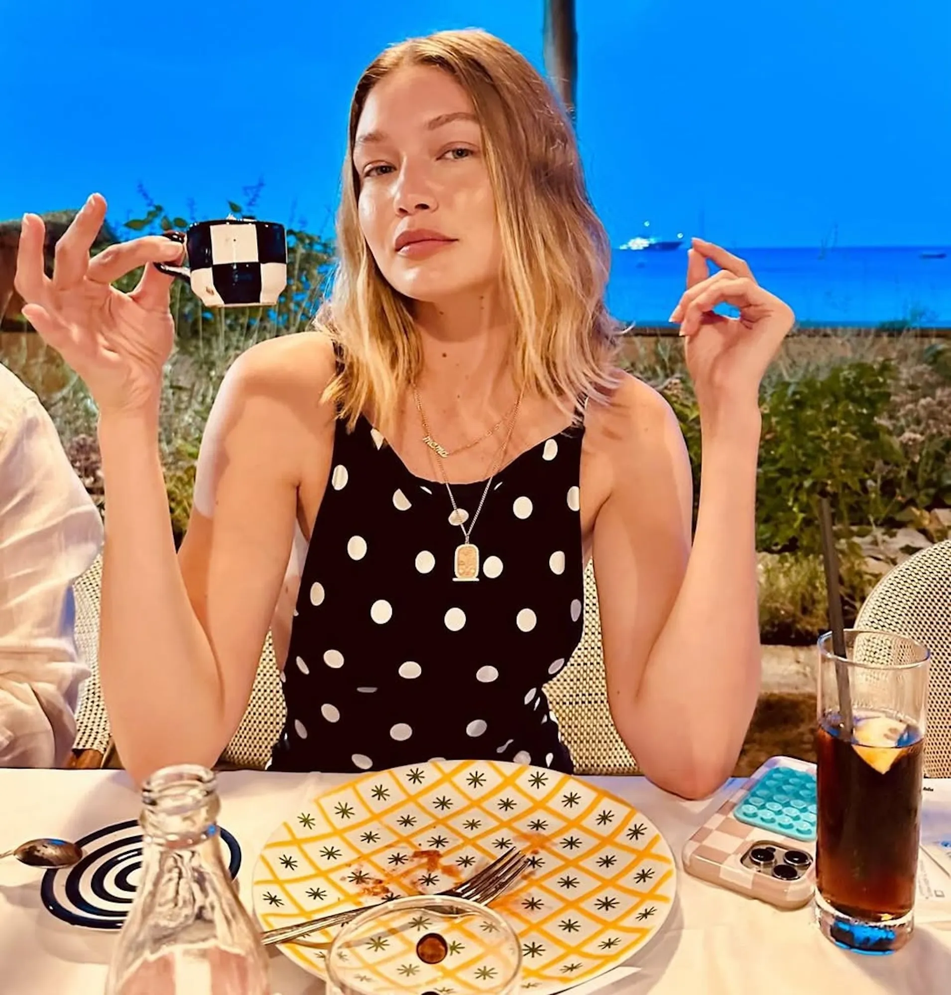 Gigi Hadid Playfully Matches Her Black and White Polka-Dot Dress to Her Teacup