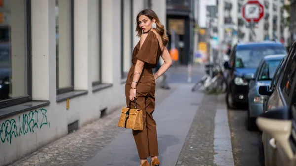 BERLIN, GERMANY - MAY 11: Masha Sedgwick is seen wearing ripped off brown overall Max Mara, clip earrings Mango, Coccinelle straw bag, Jacquemus shoes, on May 11, 2019 in Berlin, Germany. (Photo by Christian Vierig/Getty Images)