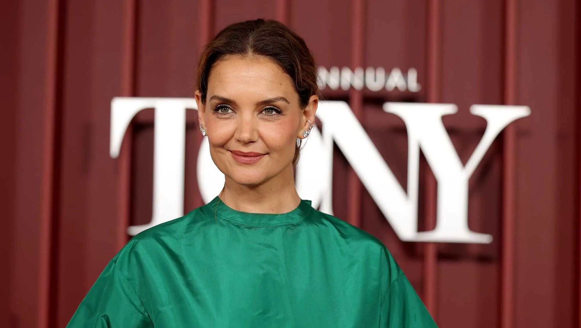 Katie Holmes wearing a green dress
