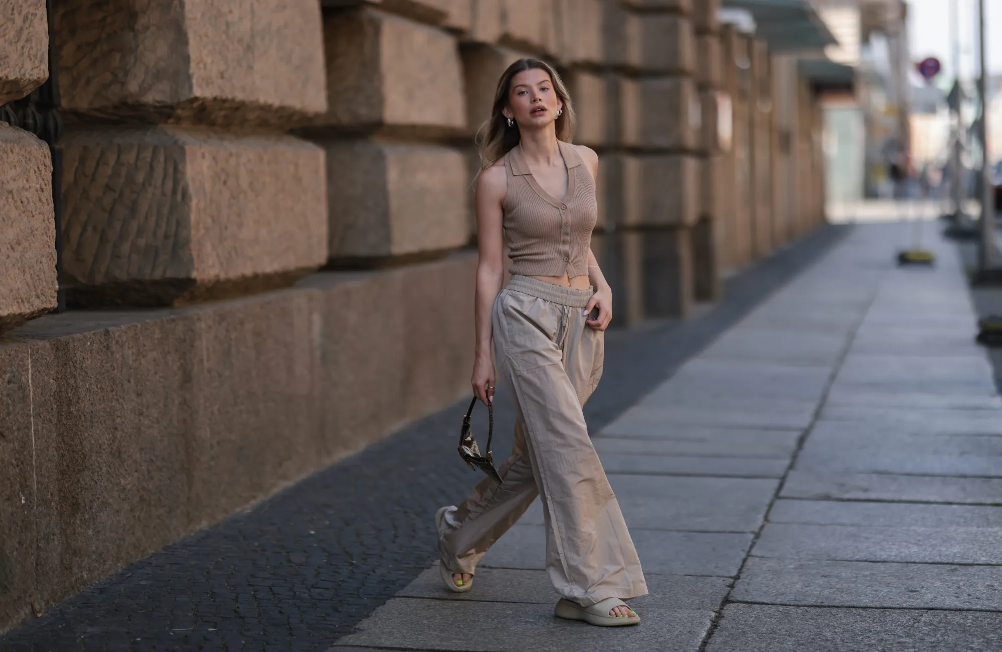 BERLIN, GERMANY - JUNE 05: Sophia Geiss seen wearing a beige ripped top from LeGer, a beige linen wide leg pants from LeGer, beige sandals from Zara and a brown Vintage Fendi bag on June 05, 2022 in Berlin, Germany. (Photo by Jeremy Moeller/Getty Images)