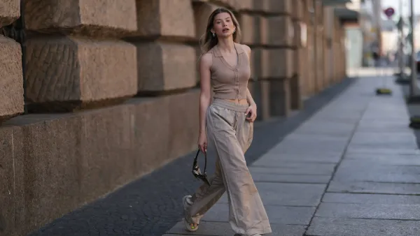 BERLIN, GERMANY - JUNE 05: Sophia Geiss seen wearing a beige ripped top from LeGer, a beige linen wide leg pants from LeGer, beige sandals from Zara and a brown Vintage Fendi bag on June 05, 2022 in Berlin, Germany. (Photo by Jeremy Moeller/Getty Images)