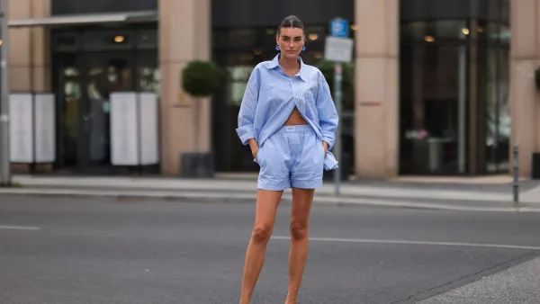 BERLIN, GERMANY - AUGUST 16: Celine Bethmann wearing blue striped Worst Behavior two piece and white Stradivarius heels on August 16, 2021 in Berlin, Germany. (Photo by Jeremy Moeller/Getty Images)