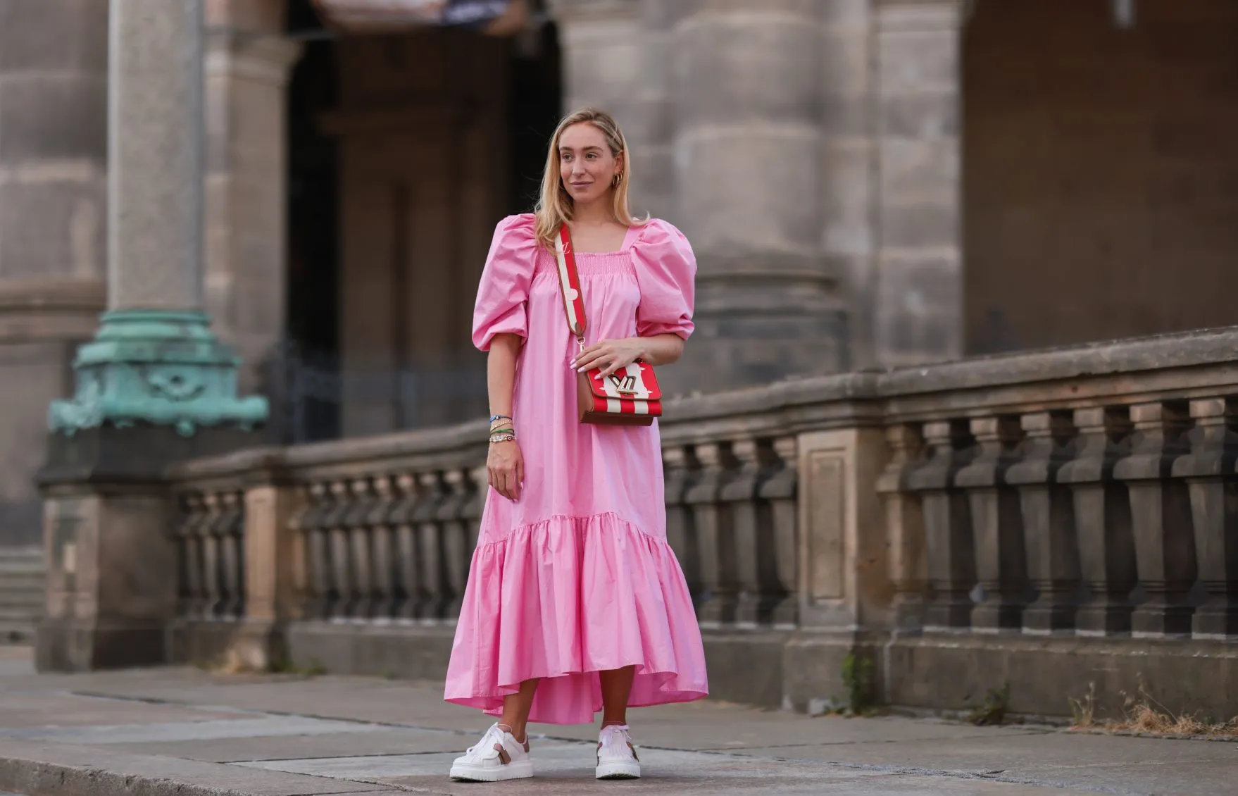 BERLIN, GERMANY - JULY 06: Sonia Lyson wearing Louis Vuitton bag, white Dior ID sneakers and pink H&M maxi dress on July 06, 2021 in Berlin, Germany. (Photo by Jeremy Moeller/Getty Images)