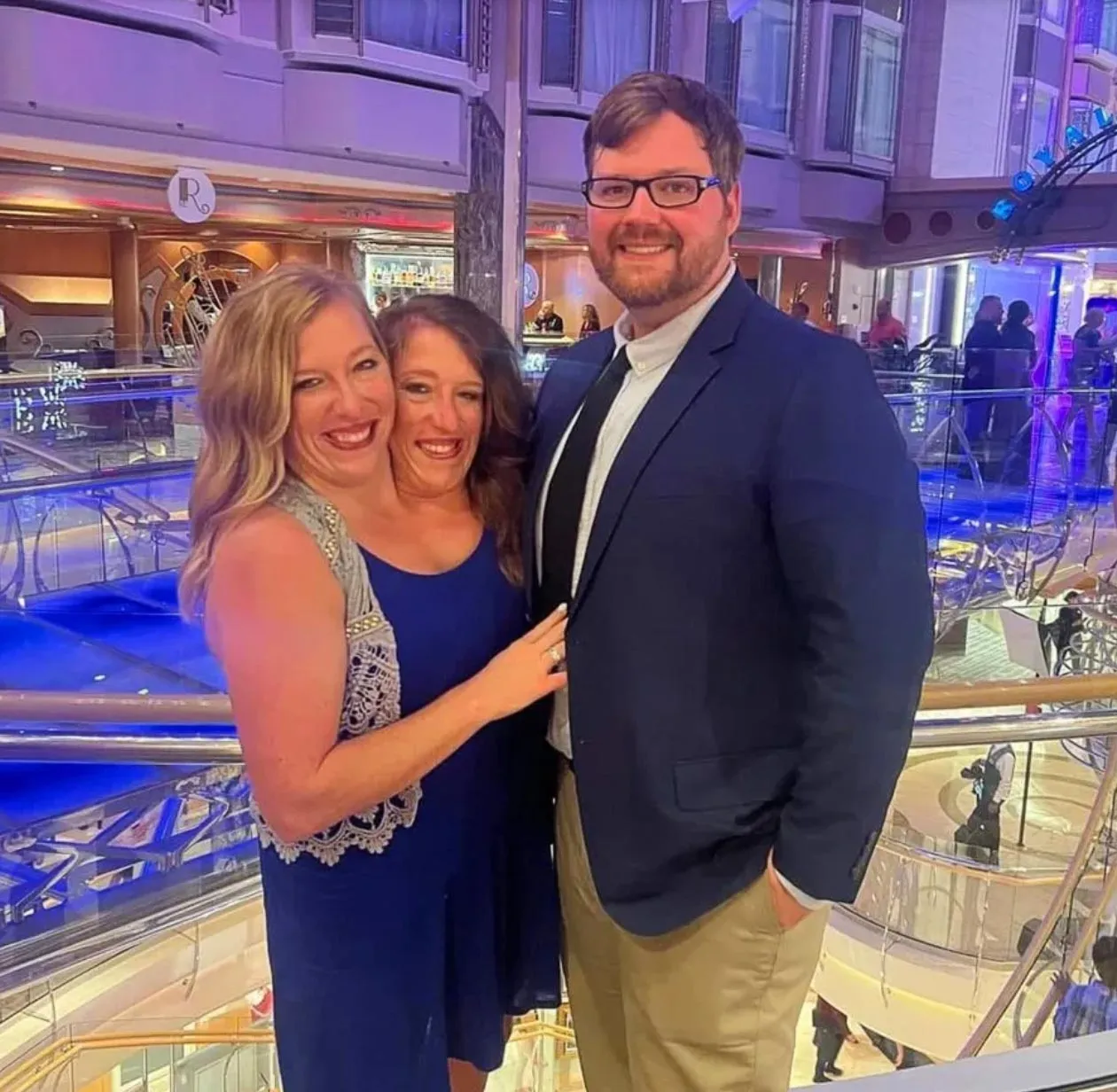 Conjoined Twins Abby and Brittany Hensel Seen on Errand Run With Their Dogs After Outing With Baby 001