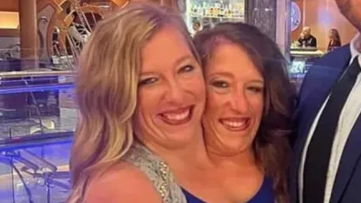 Conjoined Twins Abby and Brittany Hensel Seen on Errand Run With Their Dogs After Outing With Baby 001