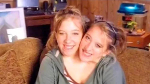 Conjoined Twins Abby and Brittany Hensel Spotted Carrying a Baby Car Seat While Visiting Their Workplace 019