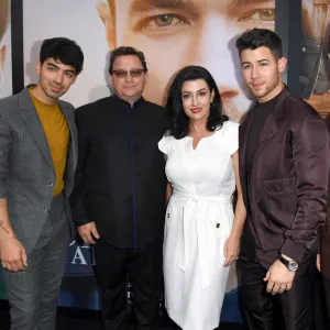 Joe Jonas, Kevin Jonas Sr., Denise Jonas, Nick Jonas and Kevin Jonas attending the "Chasing Happiness" premiere.