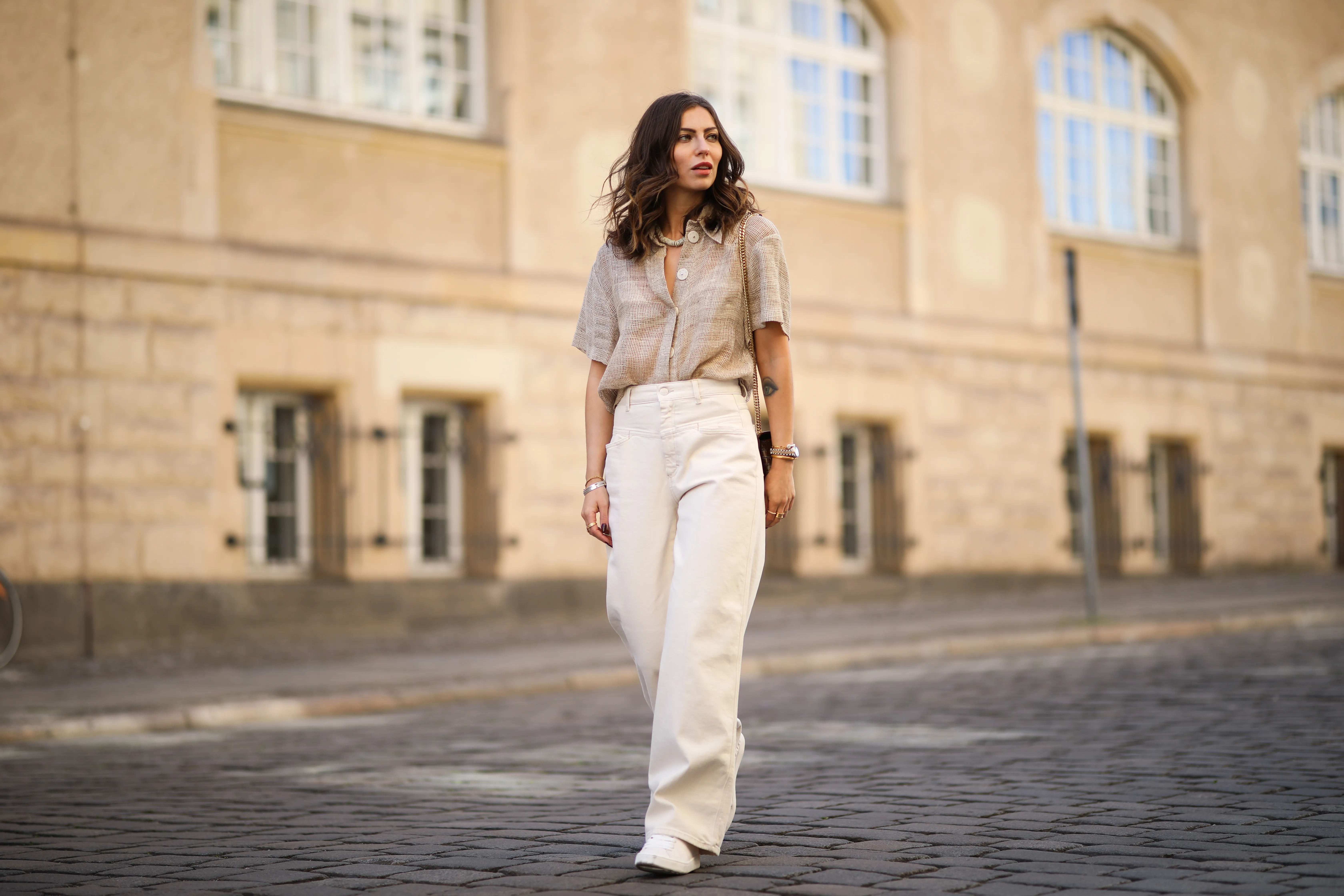 Masha Sedgwick (Maria Astor) wearing Nobi Talai blouse, Agneel bag, Closed jeans and Coach sneaker on May 06, 2020 in Berlin, Germany.