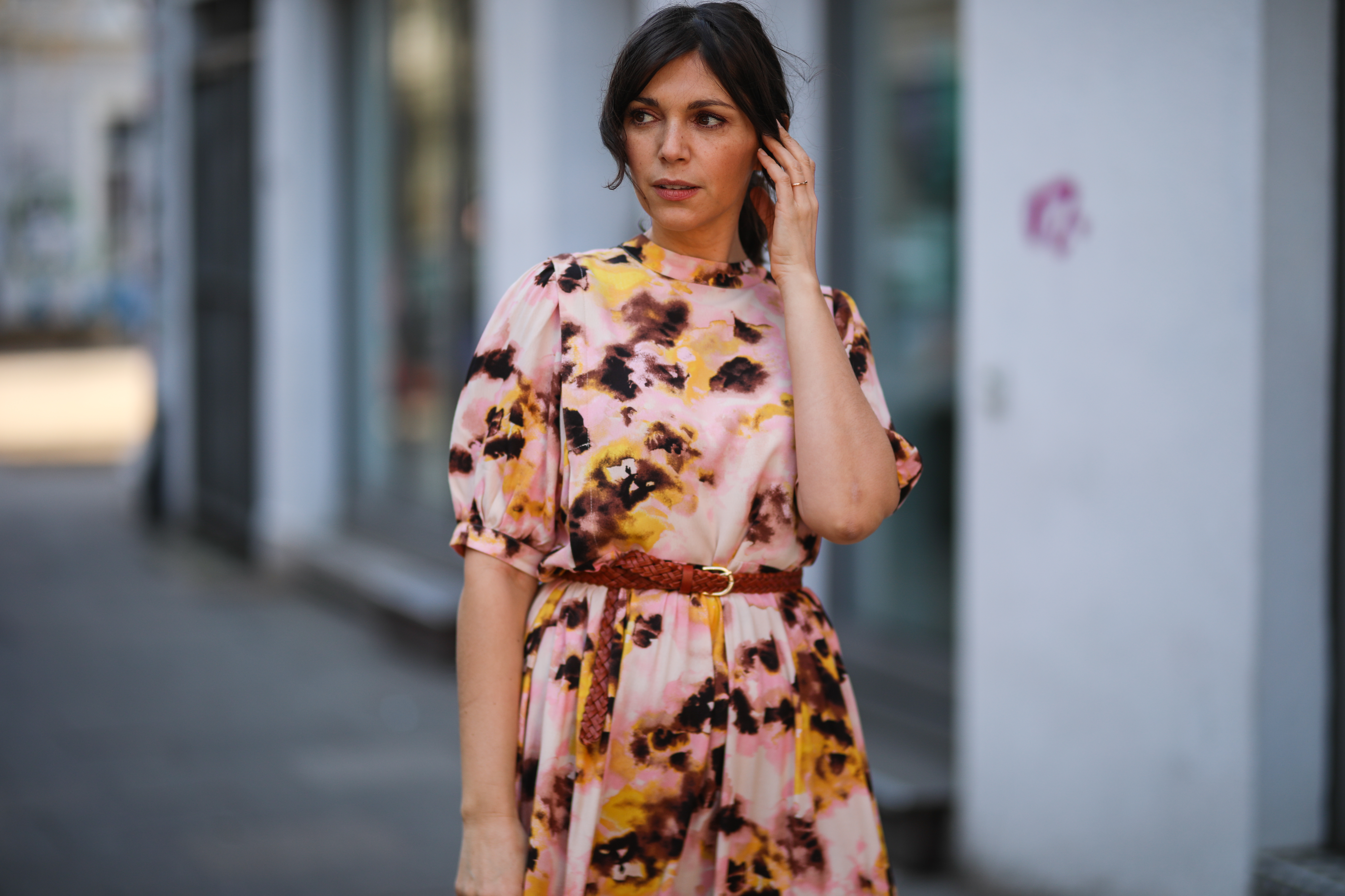 Anna Wolfers poses wearing tie-dye midi dress and brown waist belt on March 30, 2021 in Hamburg, Germany.
