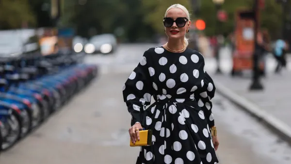 Liv Judd seen wearing a vokuhila polka dot dress, outside Carolina Herrera during new york fashion week on September 12, 2022 in New York City.