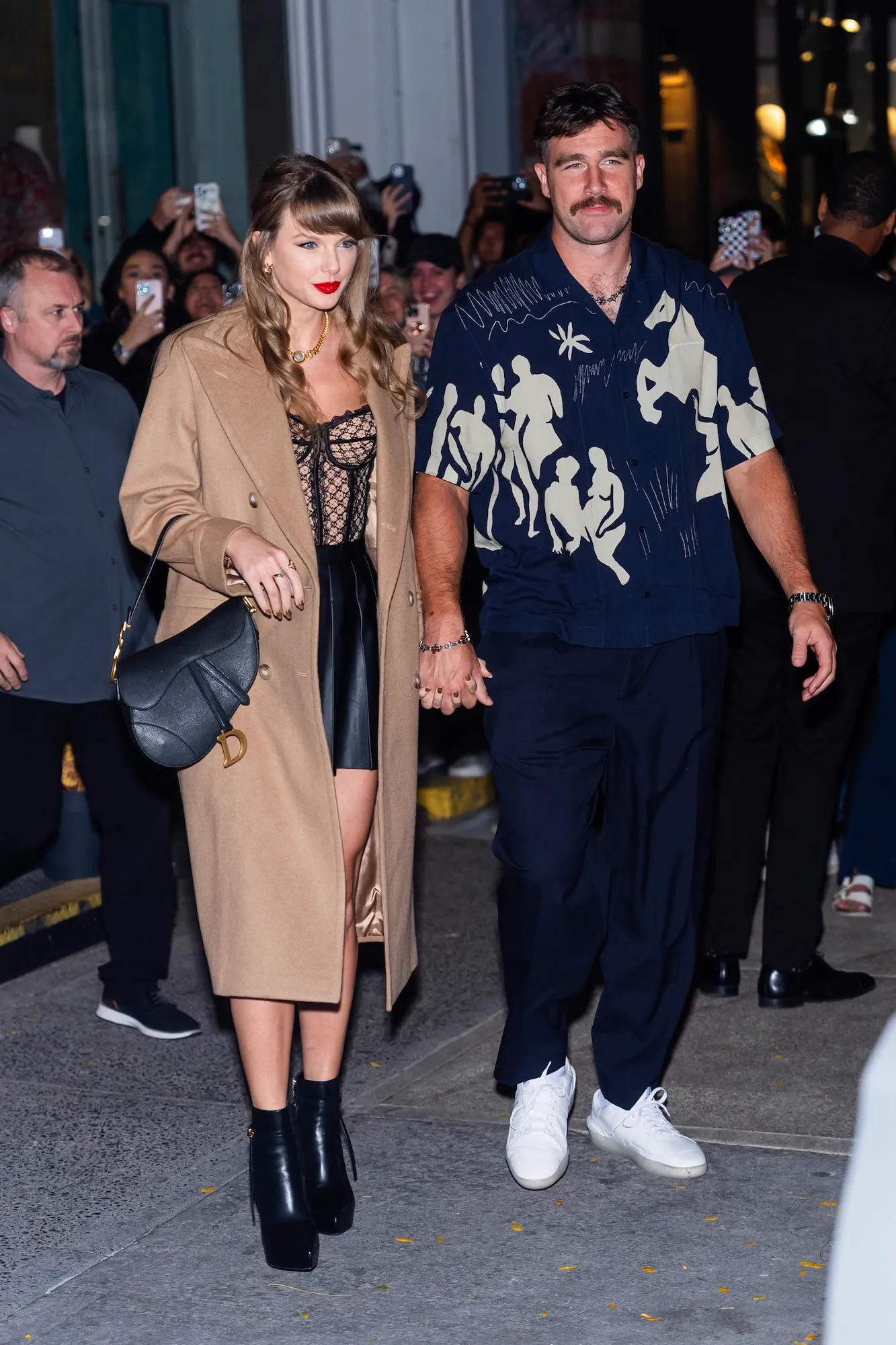 GettyImages-2178036425-Taylor-Swift-and-Travis-Kelce-Offer-Insight-Into-Romance-on-New-Heights.jpg