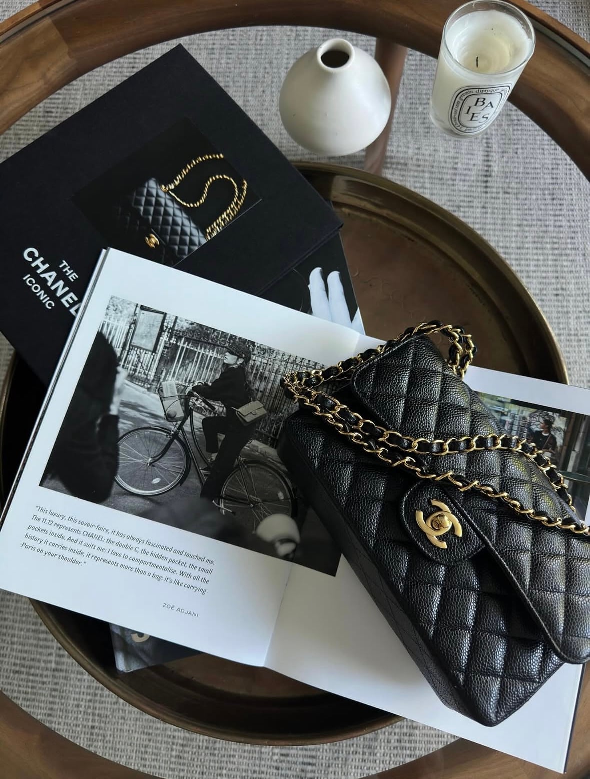 Small Chanel Classic Flap bag in black quilted leather with gold-tone chain strap and CC turn-lock closure.