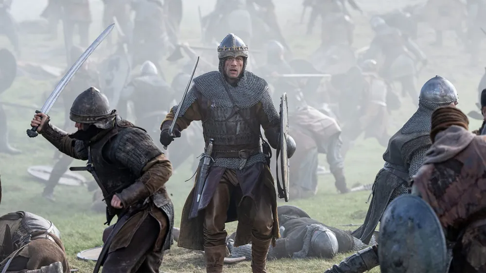 James Norton walks through a battle in King & Conqueror