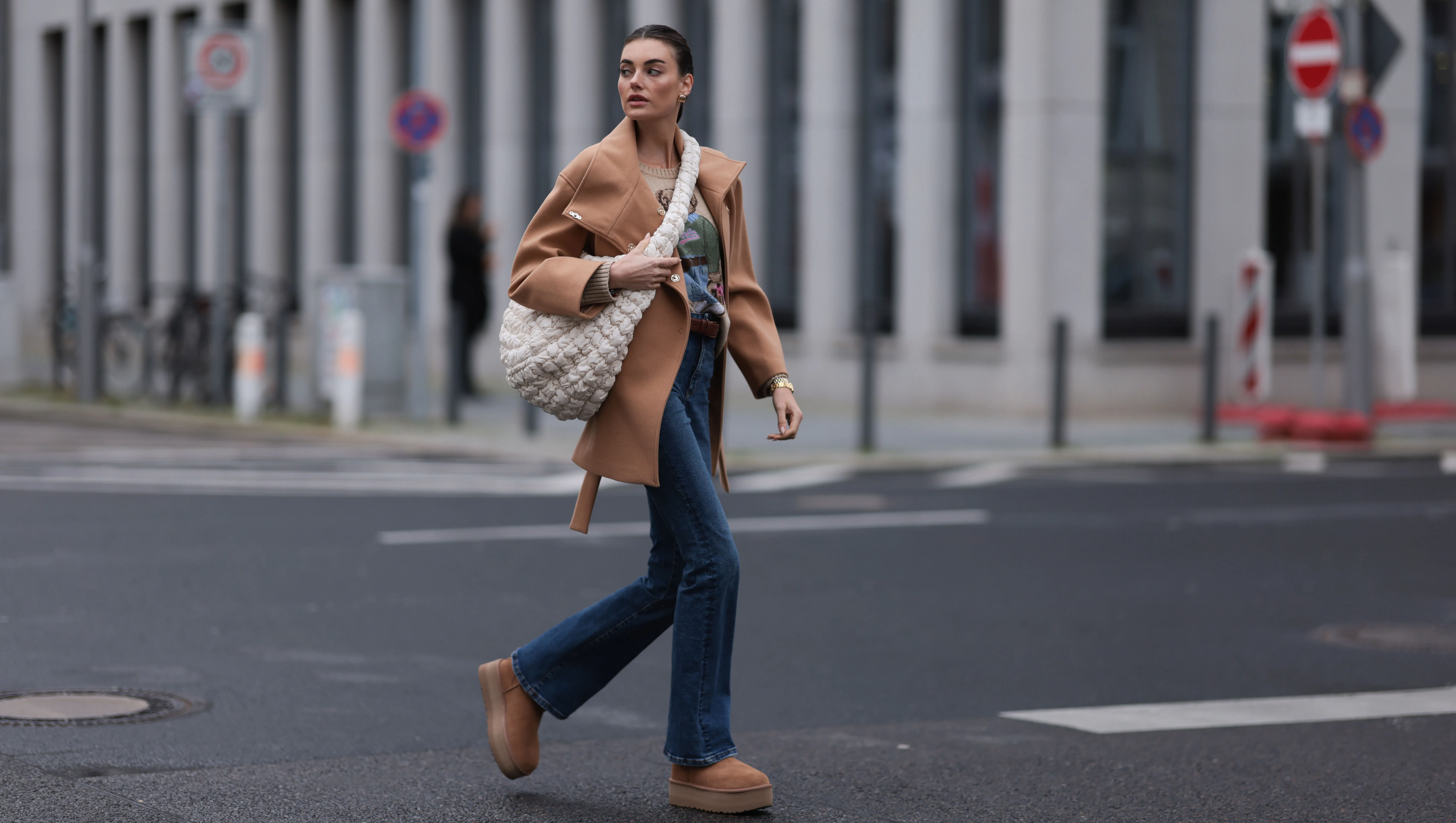 BERLIN, GERMANY - NOVEMBER 09: Celine Bethmann seen wearing gold earrings, Ralph Lauren beige wool teddy knit sweater, Liu Jo brown wool short coat, COS cream white crossbody bag, Zara blue denim jeans / pants, UGG chestnut / brown suede leather platform boots, on November 09, 2023 in Berlin, Germany. (Photo by Jeremy Moeller/Getty Images)