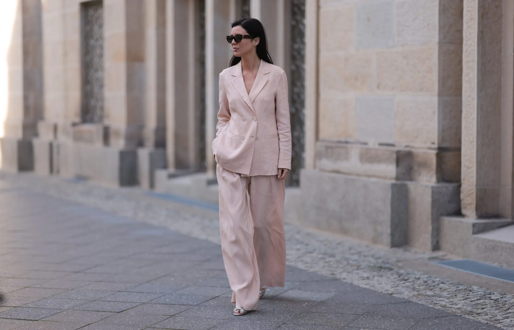 BERLIN, GERMANY - FEBRUARY 25: Leo Eberlin seen wearing YSL brown tortoise sunglasses, Leo Mathild diamond jewelry / rings and bracelet, Marc Cain light pink elegant blazer jacket, matching Marc Cain light pink elegant wide leg suit pants and Marc Cain silver leather heels, on February 25, 2024 in Berlin, Germany. (Photo by Jeremy Moeller/Getty Images)
