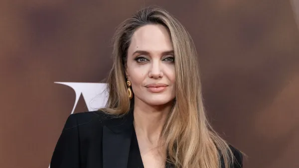 Angelina Jolie Debuts Icy Blonde Bob With Bold Red Lip While Filming Anxious People Alongside Son Maddox