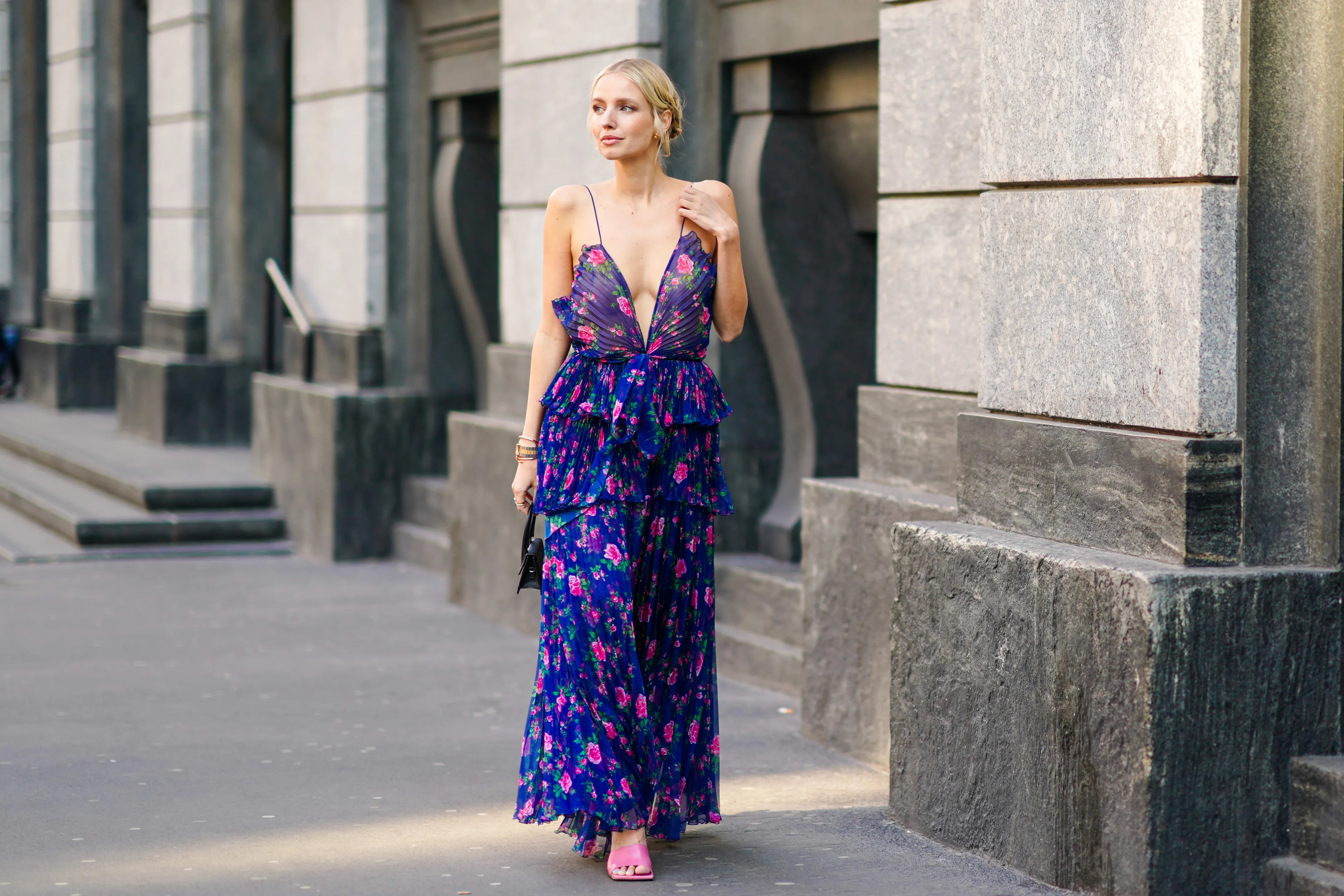 MILAN, ITALY - FEBRUARY 22: Leonie Hanne wears a blue ruffled dress with pink floral print, a black Jacquemus mini bag, outside Philosophy, during Milan Fashion Week Fall/Winter 2020-2021 on February 22, 2020 in Milan, Italy. (Photo by Edward Berthelot/Getty Images)