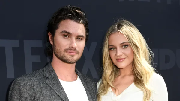 Chase Stokes and Kelsea Ballerini on a red carpet.