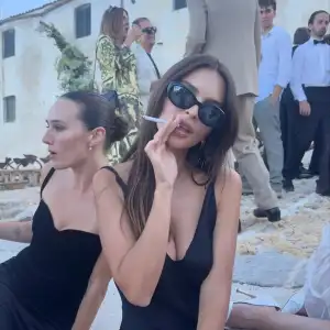 Emily Ratajkowski Goes 'Skinny Dipping' and Wears Slinky Black Dress as She Enjoys 'Party Girl Week'
