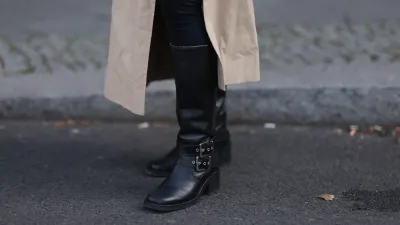 BERLIN, GERMANY - APRIL 17: Sophia Geiss seen wearing LeGer black cotton form-fitting leggings, Cos long, beige oversized trench coat with oversized lapels and a relaxed structure and & Other Stories black leather knee-high boots with a modest heel, adding a bit of edge and sophistication, on April 17, 2025 in Berlin, Germany. (Photo by Jeremy Moeller/Getty Images)