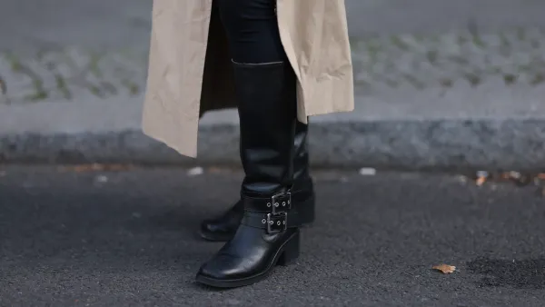 BERLIN, GERMANY - APRIL 17: Sophia Geiss seen wearing LeGer black cotton form-fitting leggings, Cos long, beige oversized trench coat with oversized lapels and a relaxed structure and & Other Stories black leather knee-high boots with a modest heel, adding a bit of edge and sophistication, on April 17, 2025 in Berlin, Germany. (Photo by Jeremy Moeller/Getty Images)