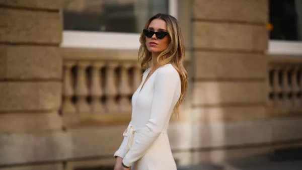 DUSSELDORF, GERMANY - MARCH 24: Scarlett Gartmann wearing Kapten & Son shades, beige & other stories dress and beige Lady Dior leather bag on March 24, 2021 in Dusseldorf, Germany. (Photo by Jeremy Moeller/Getty Images)