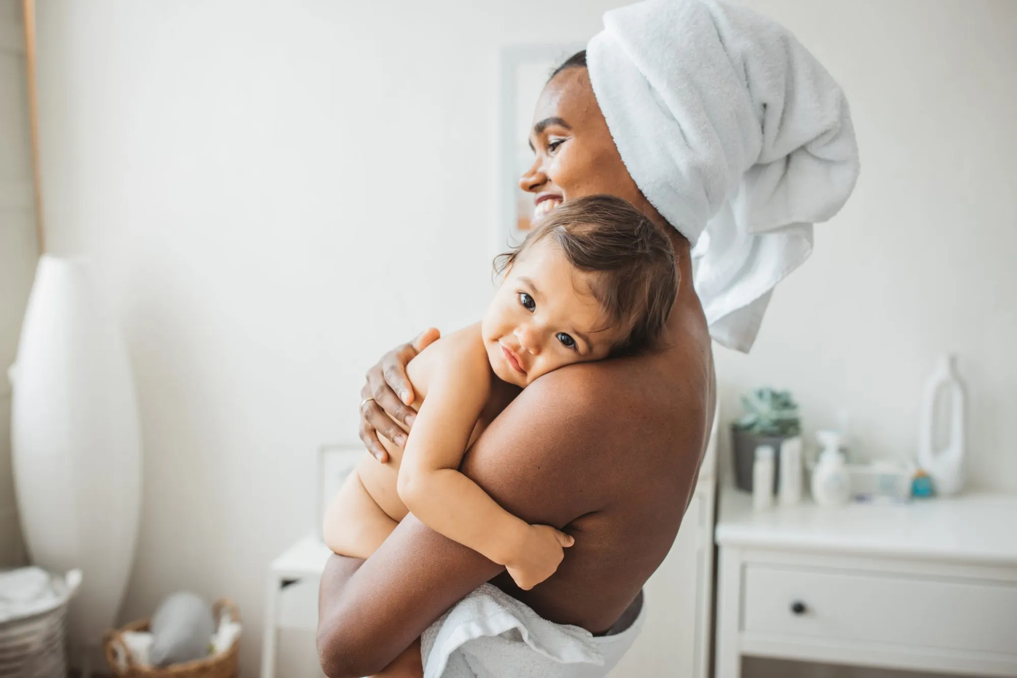 Mother and baby girl enjoying in their time after bath.