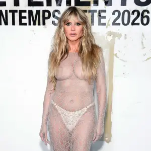 Feature Heidi Klum Rocks Nipple Baring Sheer Lace Gown and Gold Grill During Paris Fashion Week Event