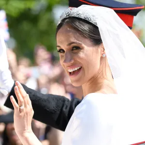 WINDSOR, ENGLAND - MAY 19: Meghan, Duchess of Sussex leaves Windsor Castle in the Ascot Landau carriage during a procession after getting married at St Georges Chapel on May 19, 2018 in Windsor, England. Prince Henry Charles Albert David of Wales marries Ms. Meghan Markle in a service at St George's Chapel inside the grounds of Windsor Castle. Among the guests were 2200 members of the public, the royal family and Ms. Markle's mother, Doria Ragland. (Photo by Karwai Tang/WireImage)