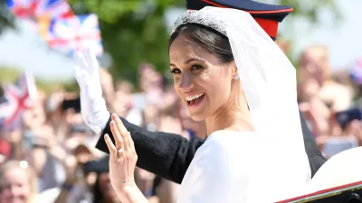 WINDSOR, ENGLAND - MAY 19: Meghan, Duchess of Sussex leaves Windsor Castle in the Ascot Landau carriage during a procession after getting married at St Georges Chapel on May 19, 2018 in Windsor, England. Prince Henry Charles Albert David of Wales marries Ms. Meghan Markle in a service at St George's Chapel inside the grounds of Windsor Castle. Among the guests were 2200 members of the public, the royal family and Ms. Markle's mother, Doria Ragland. (Photo by Karwai Tang/WireImage)