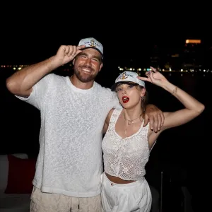 Travis Kelce Taylor Swift Kiss Backstage in Eras Tour Trailer