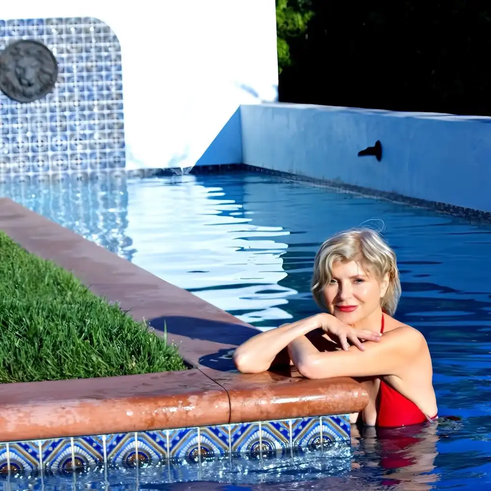 Sabrina the Teenage Witch's Beth Broderick, 66, Shows Off Her Bikini Body While 'Pooling Around'