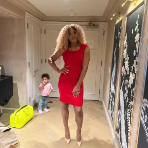 Serena Williams’ Daughter Hilariously Photobombs Her While Posing in a Hot Red Dress
