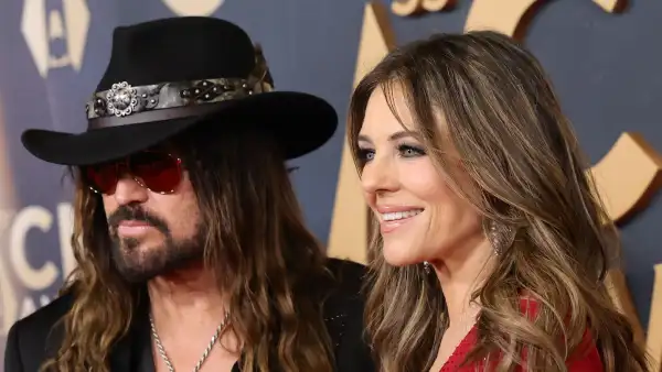 Billy Ray Cyrus and Elizabeth Hurley Hold Hands on Red Carpet Before Presenting at 2025 CMA Awards GettyImages-2247543671