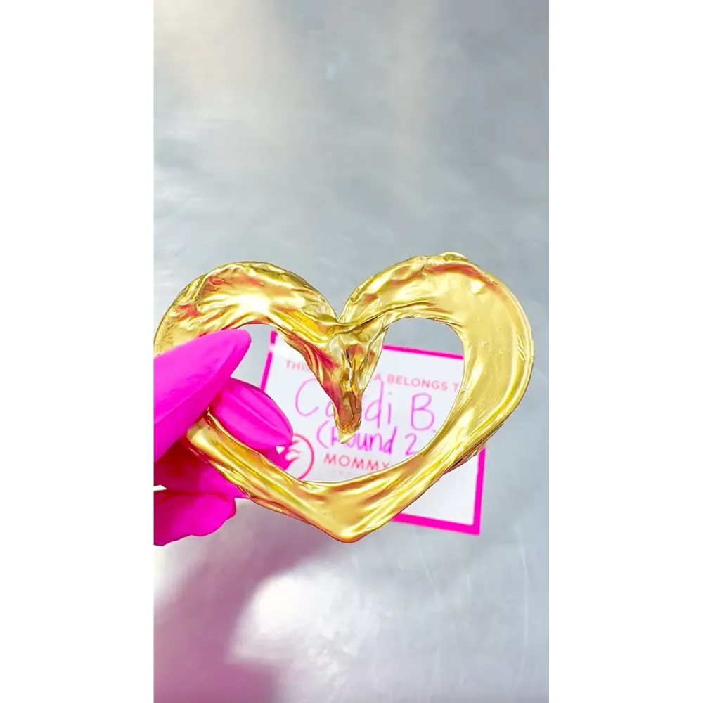 Cardi B Turns Her Umbilical Cord Into a Gold Jewelry Pendant