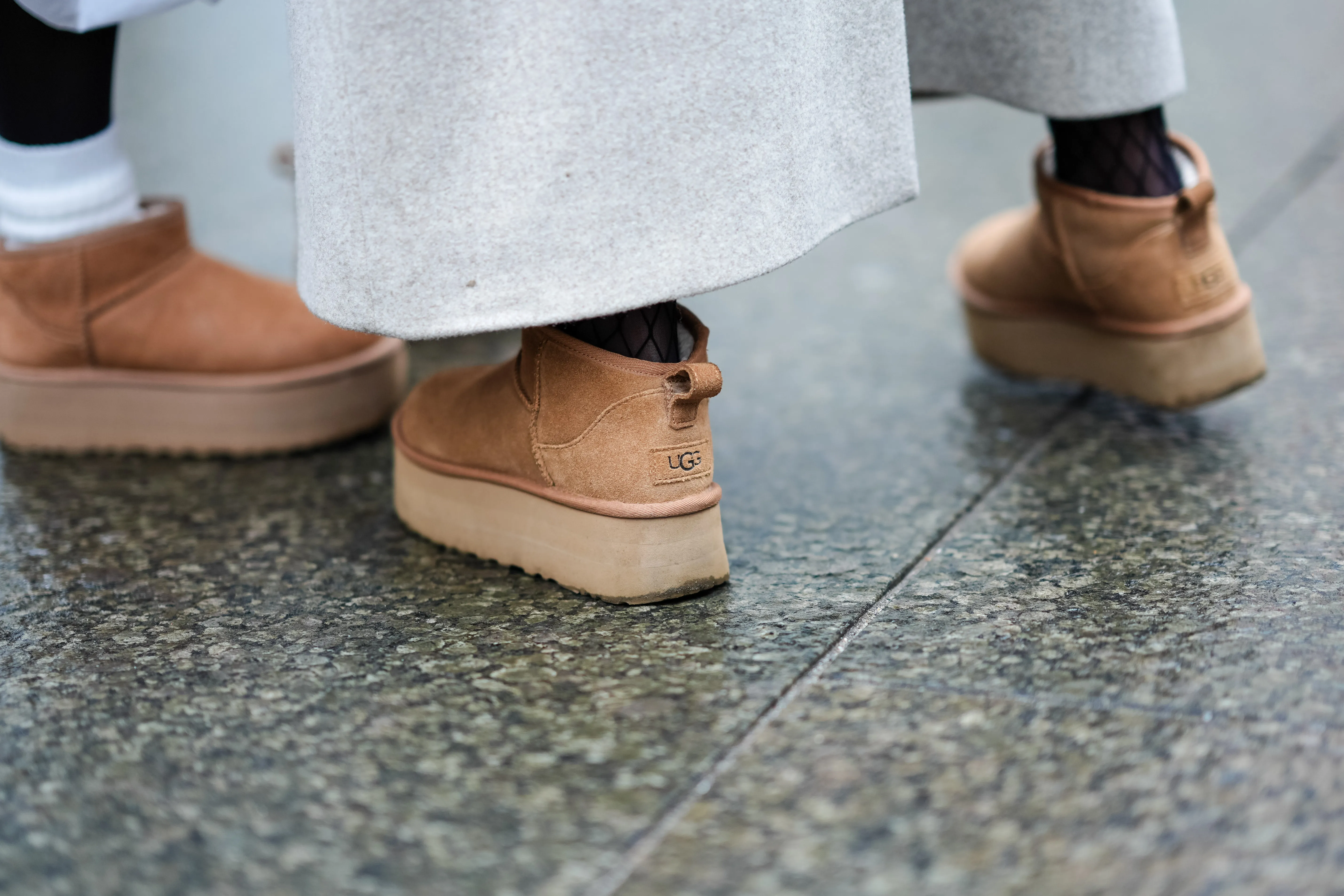 Close-up detail view of brown suede UGG shoes, outside Aeron, during the Copenhagen Fashion Week AW24 on January 30, 2024 in Copenhagen, Denmark.