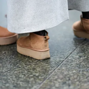 Close-up detail view of brown suede UGG shoes, outside Aeron, during the Copenhagen Fashion Week AW24 on January 30, 2024 in Copenhagen, Denmark.