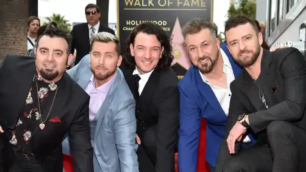 Chris Kirkpatrick, Lance Bass, JC Chasez, Joey Fatone and Justin Timberlake of 'NSync pose with their star on the Hollywood Walk of Fame.