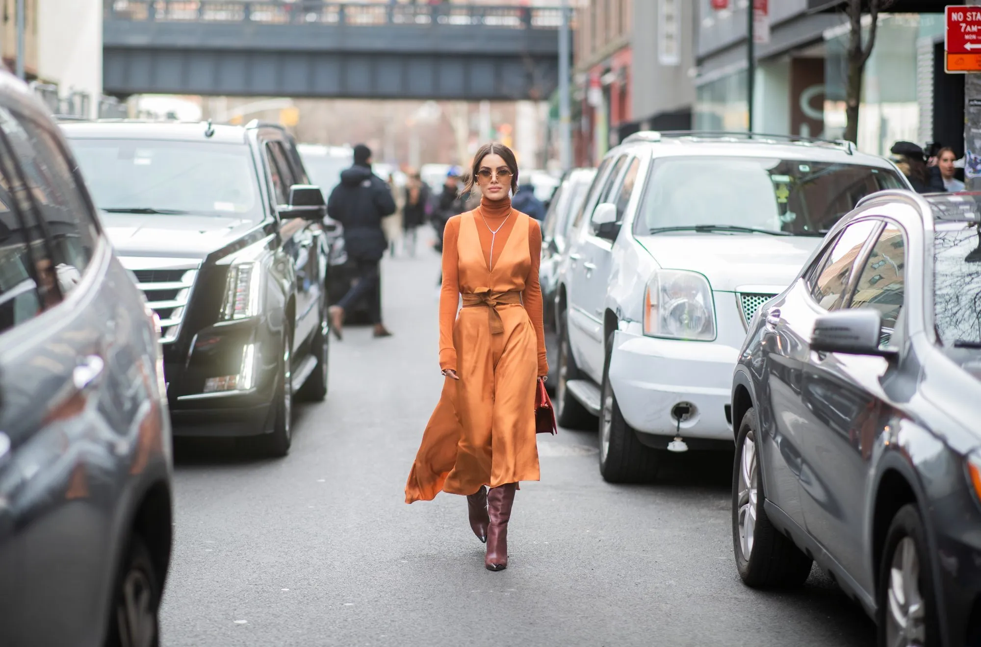 NEW YORK, NEW YORK - FEBRUARY 10: Camila Coelho is seen wearing orange turtleneck, belted dress outside Tibi during New York Fashion Week Autumn Winter 2019 on February 10, 2019 in New York City. (Photo by Christian Vierig/Getty Images)