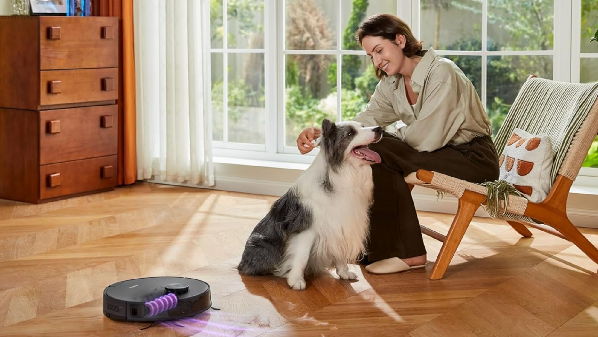 Woman using a Eureka Robot Vacuum in living room