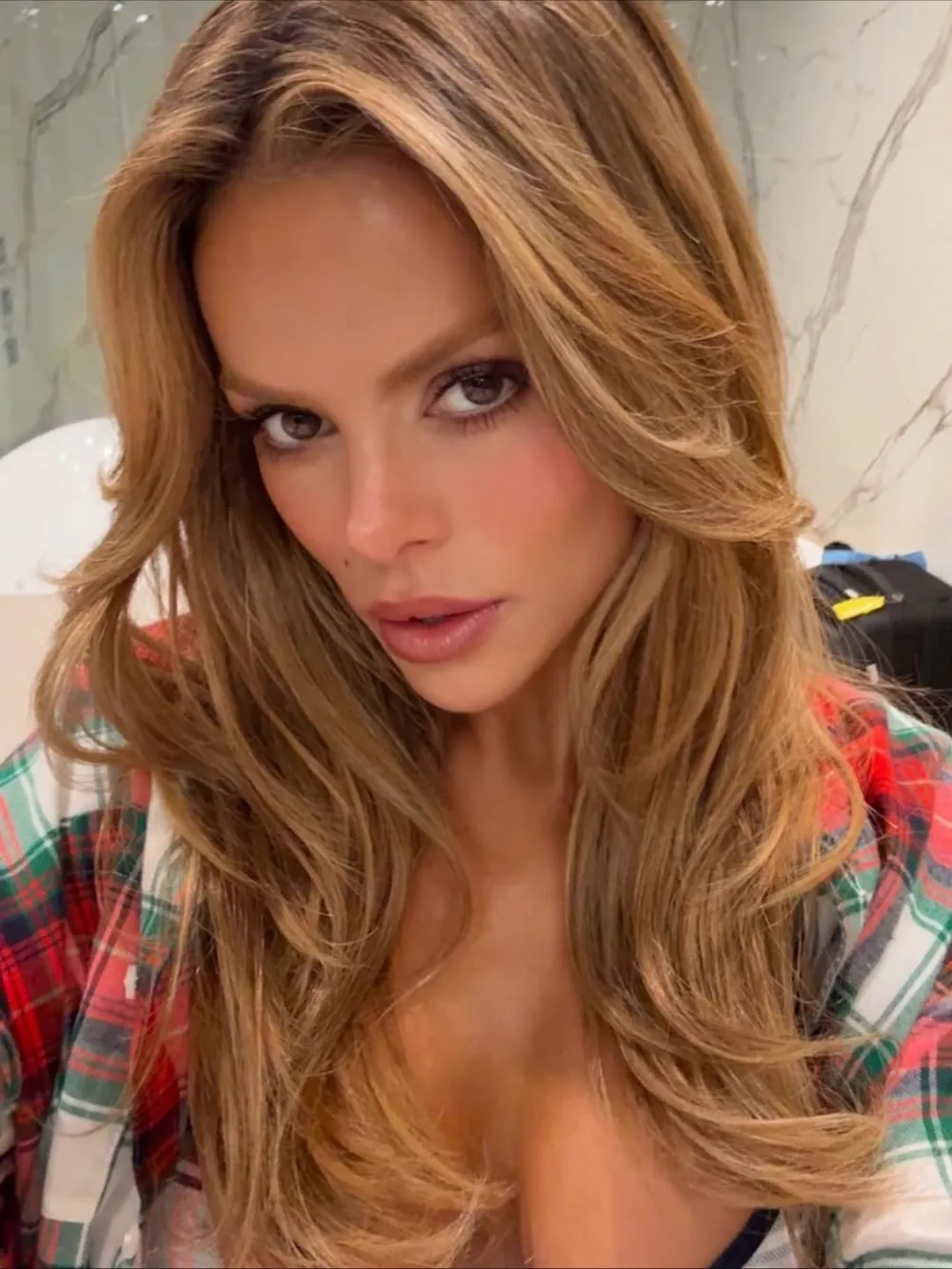 Brooks Nader Shows Off Her Bra in a Cozy Plaid Pajama Set: &lsquo;I Don&rsquo;t Look Real&rsquo;